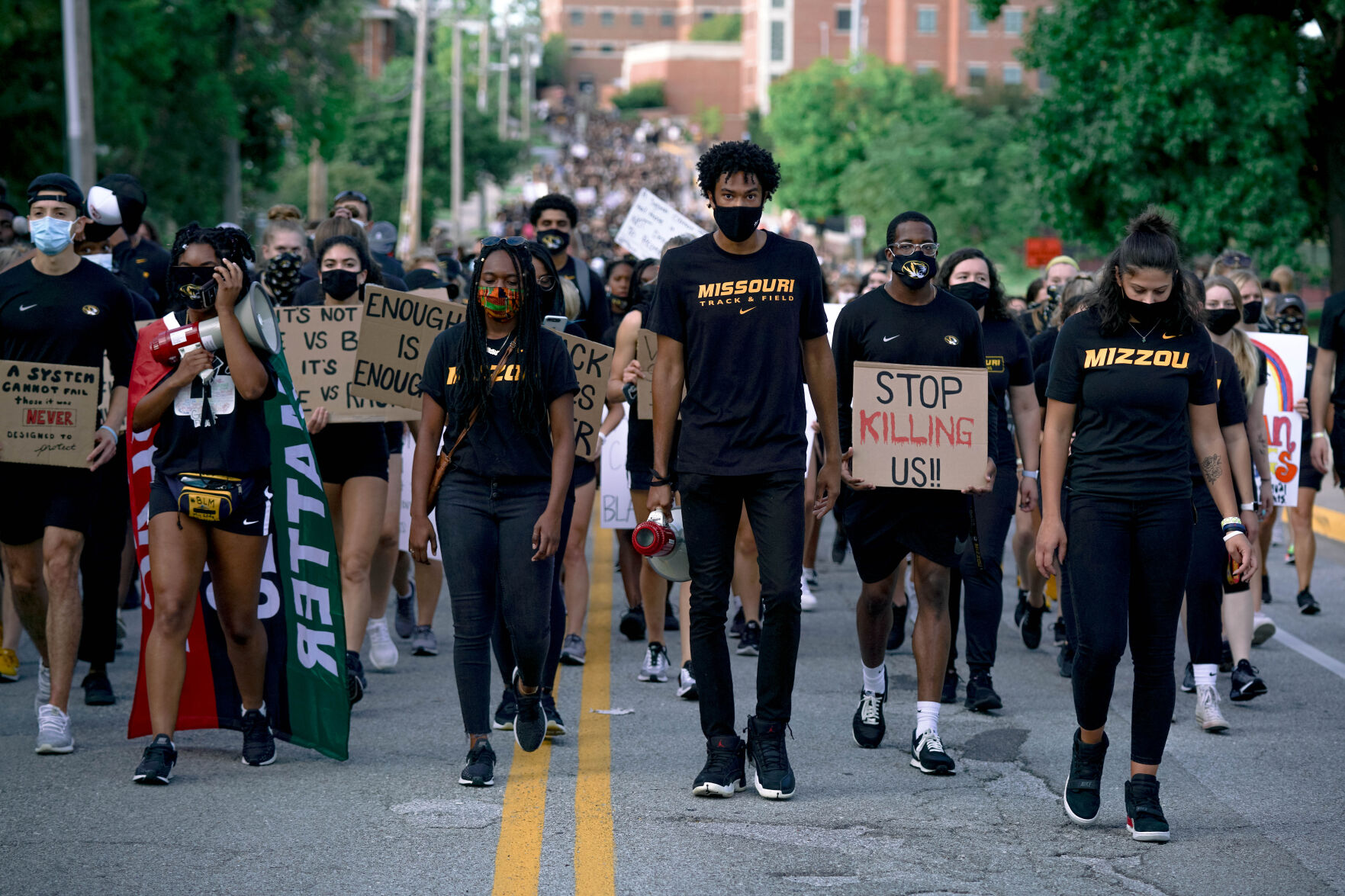 Cason Suggs, center, leads hundreds of protesters down Tiger Ave. (copy)